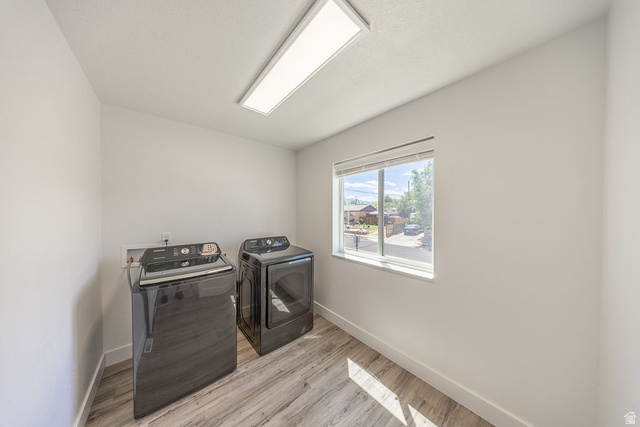 4991 South 475 West Washington Terrace, UT 84405 - Photo 27 of 31 LARGE laundry room with LVP flooring, a window with blinds, and a ceiling-mounted rectangular light fixture