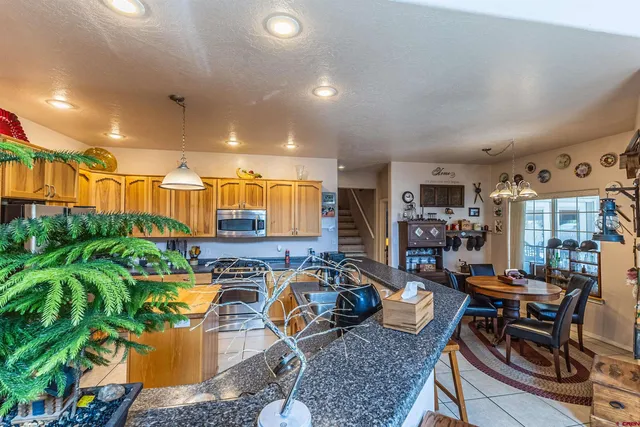 a bedroom with furniture and a flat screen tv