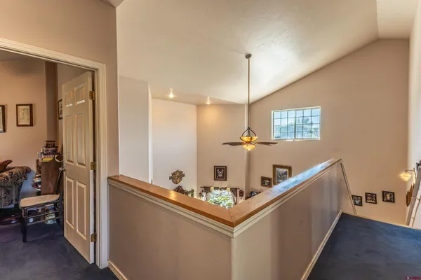 a bedroom with a bed dresser and a window