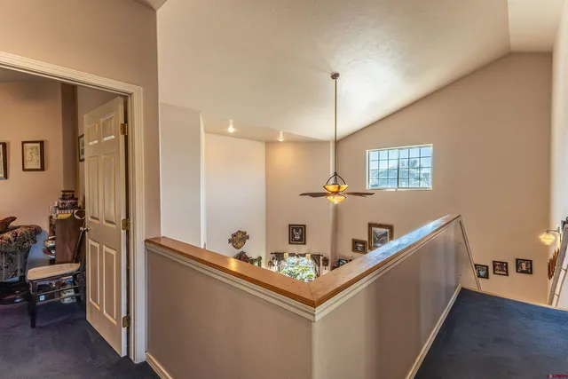 a bedroom with a bed dresser and a window