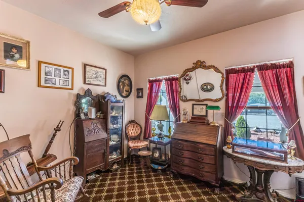 a view of a livingroom with furniture and workspace