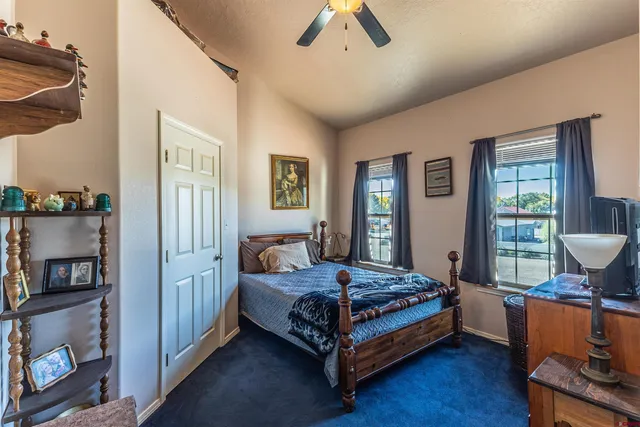 a living room with lots of furniture and a chandelier
