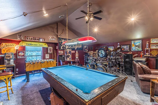 a room with lots of furniture and a chandelier