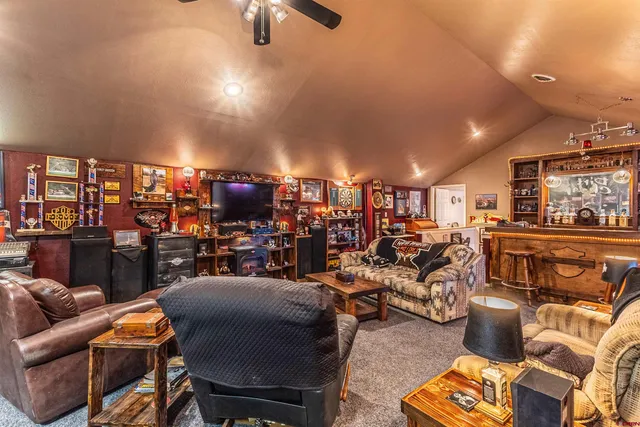 a kitchen with stainless steel appliances granite countertop a stove and a wooden cabinets