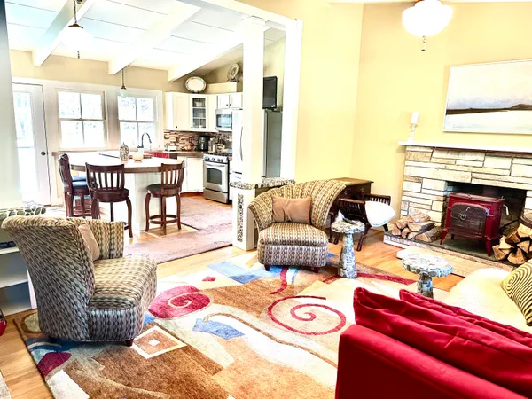 a view of a dining room with furniture and a rug