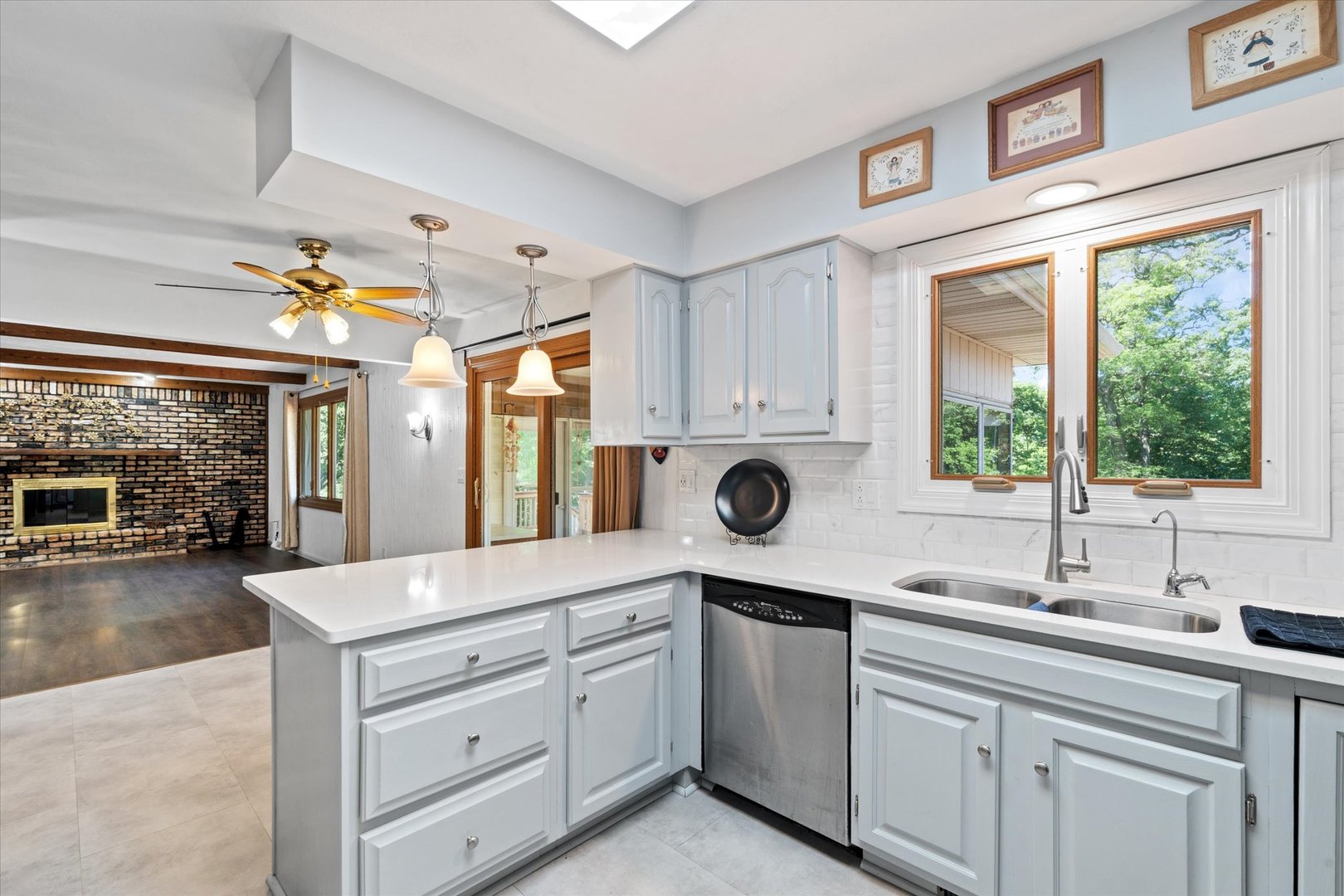 10 Oak Grove Road Geneseo, IL 61254 - Photo 12 of 43 a kitchen with a sink window and cabinets