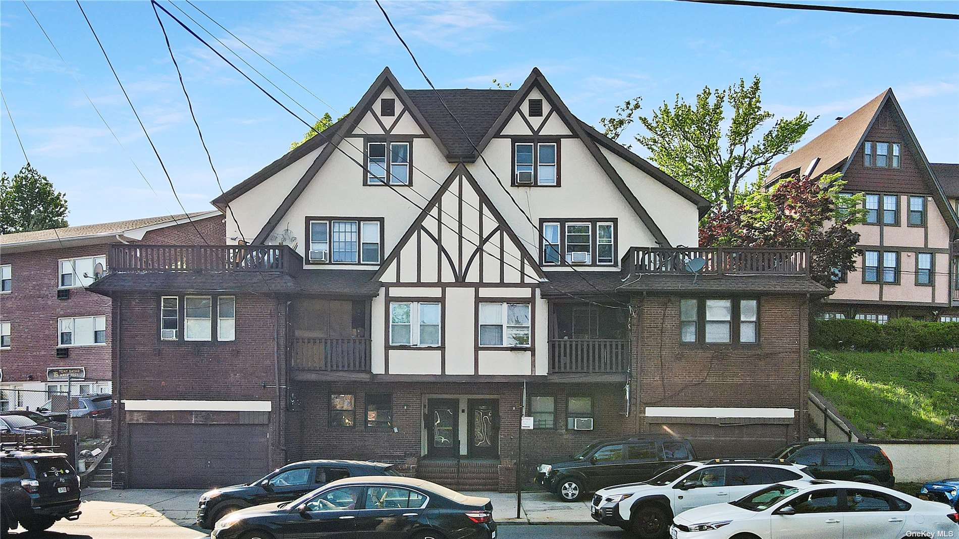 2401-2407 Richmond Road Staten Island, NY 10306 - Photo 1 of 5 a front view of a house with parking space
