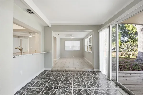 a bathroom with a glass door shower and a sink