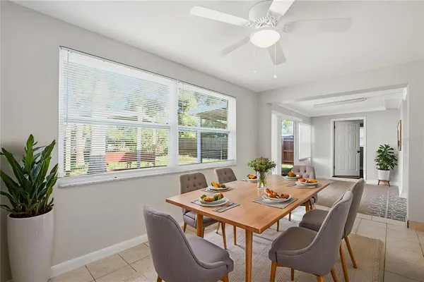 a view of a dining room with furniture and window