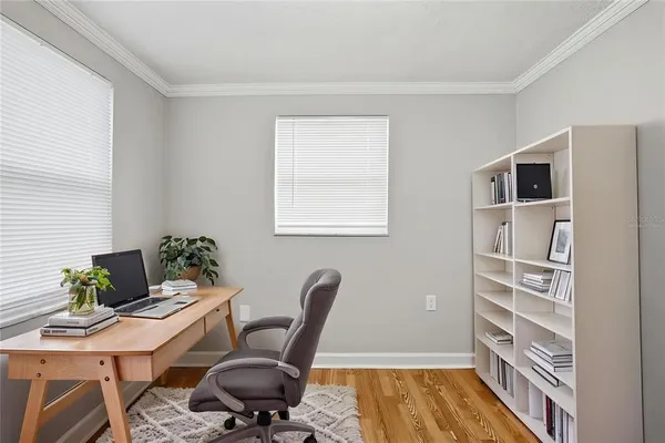 a workspace with furniture and a window