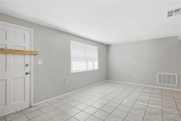 a view of an empty room with window