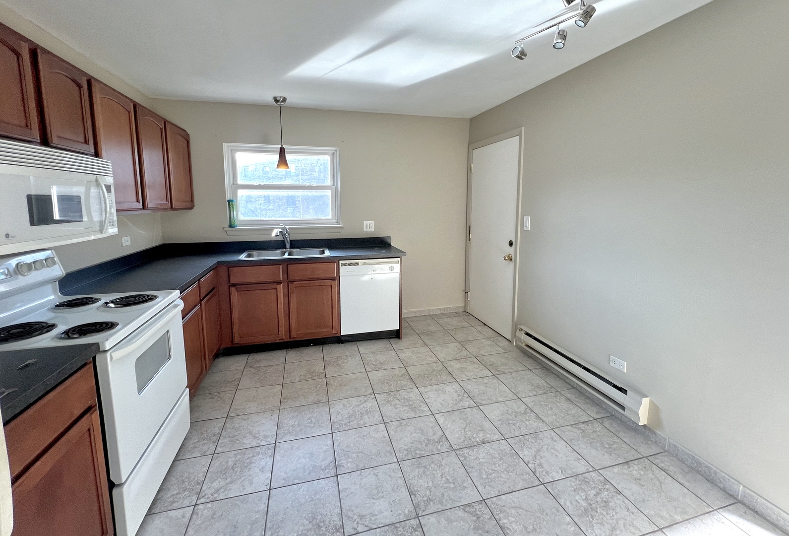 2225 West Nichols Road, Unit D Arlington Heights, IL 60004 - Photo 4 of 12 a kitchen with stainless steel appliances granite countertop a sink stove and cabinets