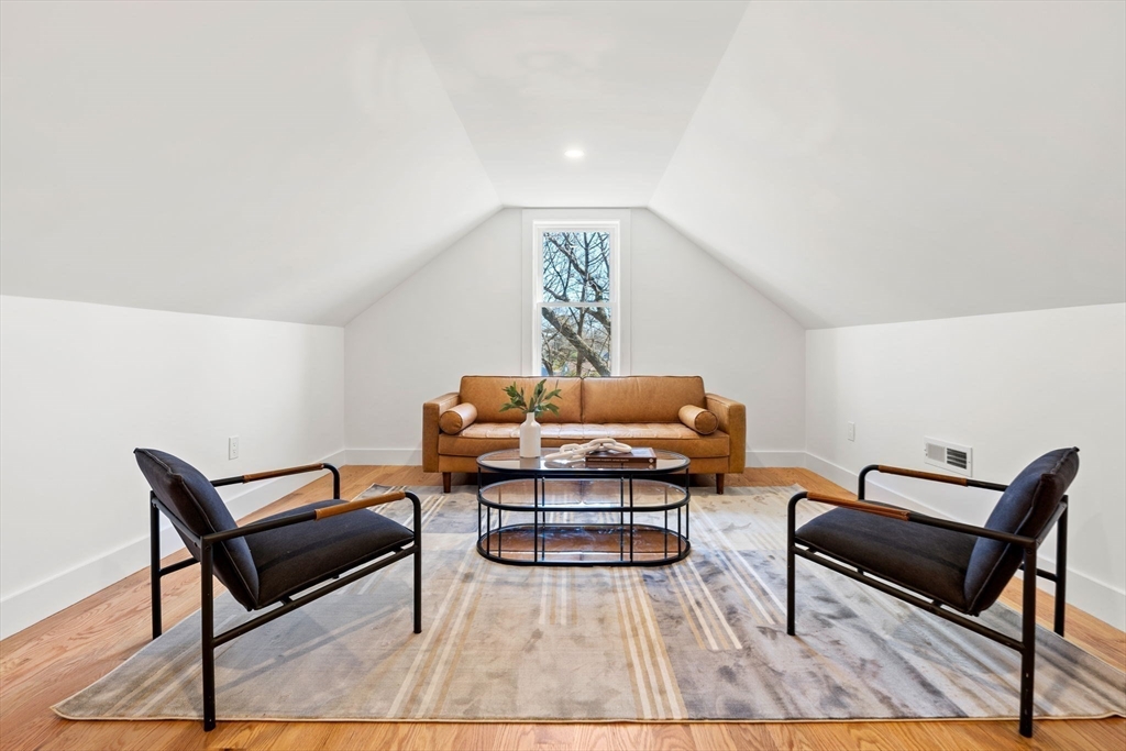 4 Wilbur Street Woburn, MA 01801 - Photo 26 of 39 a living room with furniture and wooden floor