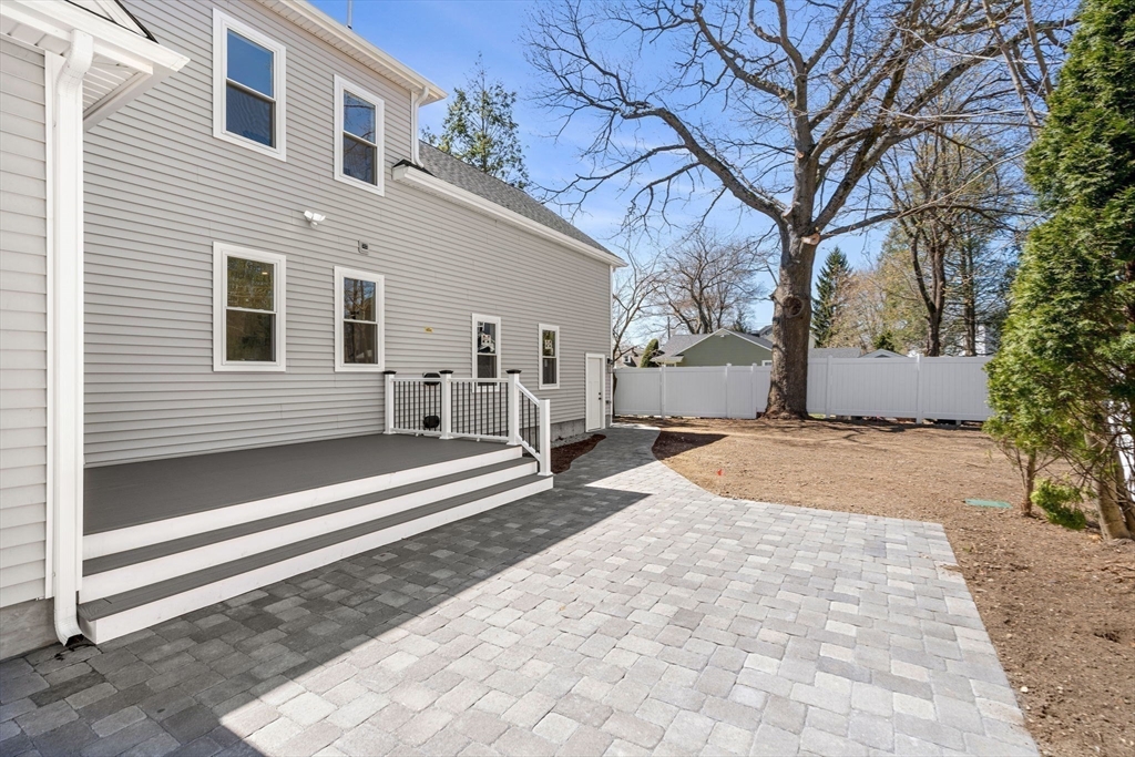 4 Wilbur Street Woburn, MA 01801 - Photo 35 of 39 a view of a house with a yard and large tree