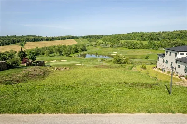 a view of lake with green space