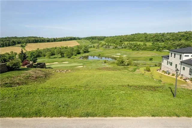 a view of lake with green space