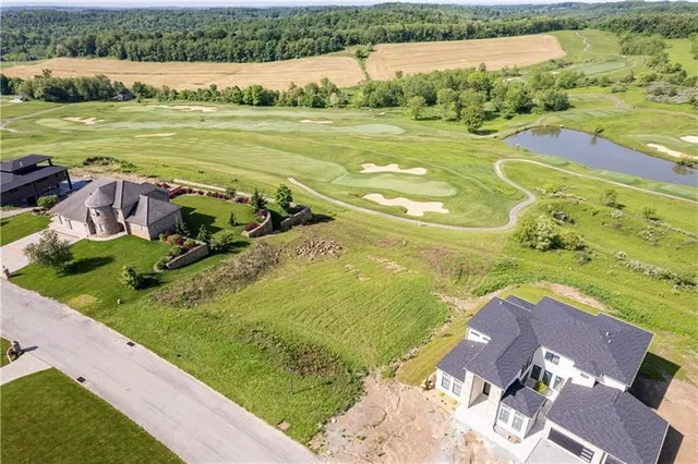a view of a lake with a yard