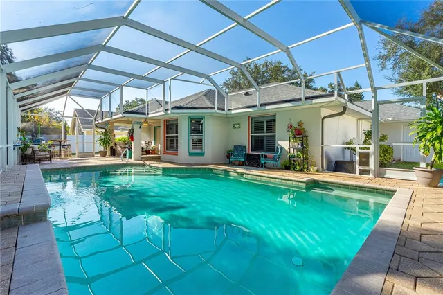a view of a swimming pool with a patio