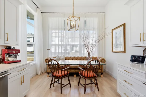 a view of a dining room with furniture and window