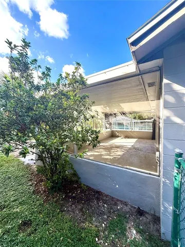a view of a porch with a tree