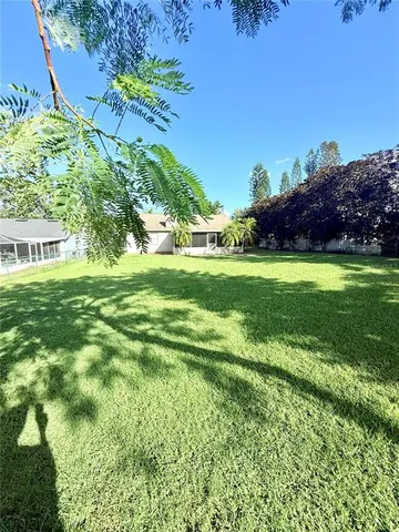 a backyard of a house with lots of green space