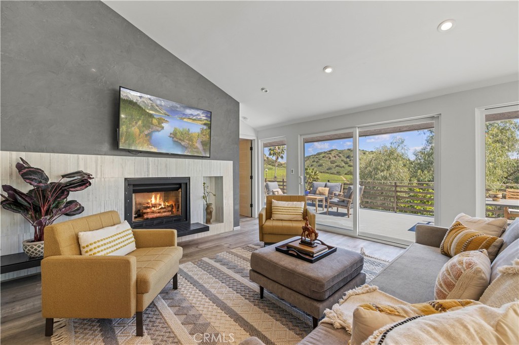 120 Rollins Road Chatsworth, CA 91311 - Photo 1 of 25 a living room with furniture fireplace and a large window