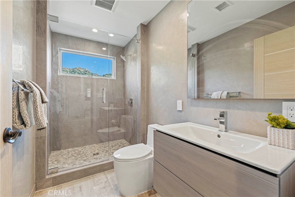 120 Rollins Road Chatsworth, CA 91311 - Photo 15 of 25 a bathroom with a sink a toilet and shower