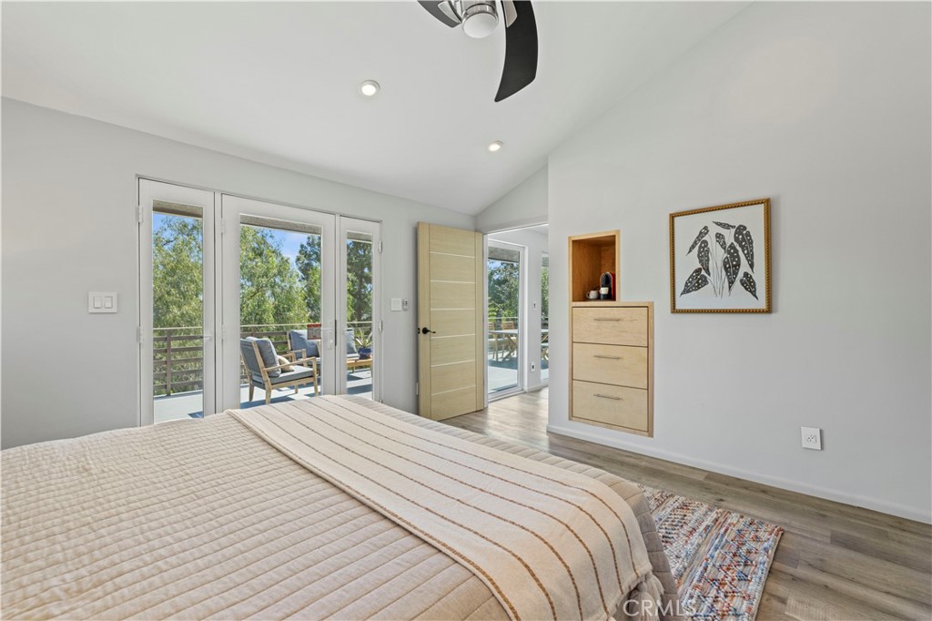 120 Rollins Road Chatsworth, CA 91311 - Photo 8 of 25 a bedroom with a large bed and a flat tv screen