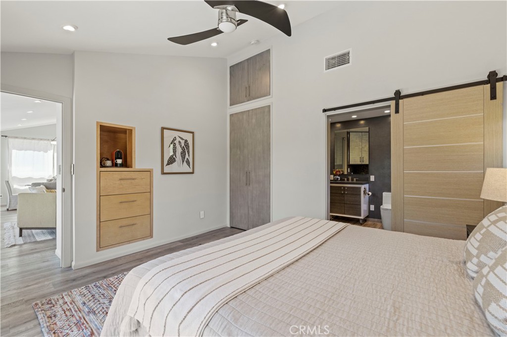 120 Rollins Road Chatsworth, CA 91311 - Photo 9 of 25 a bedroom with a bed and a cabinets