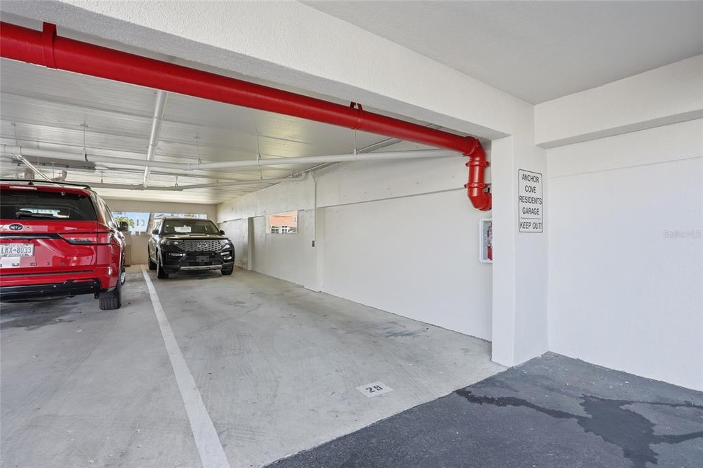 363 Pinellas Bayway South, Unit 29 Tierra Verde, FL 33715 - Photo 39 of 59 a view of car parked in garage