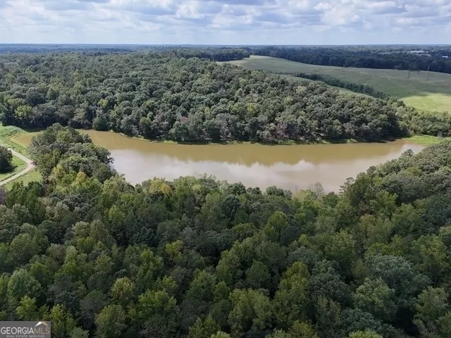 a view of a lake with a yard
