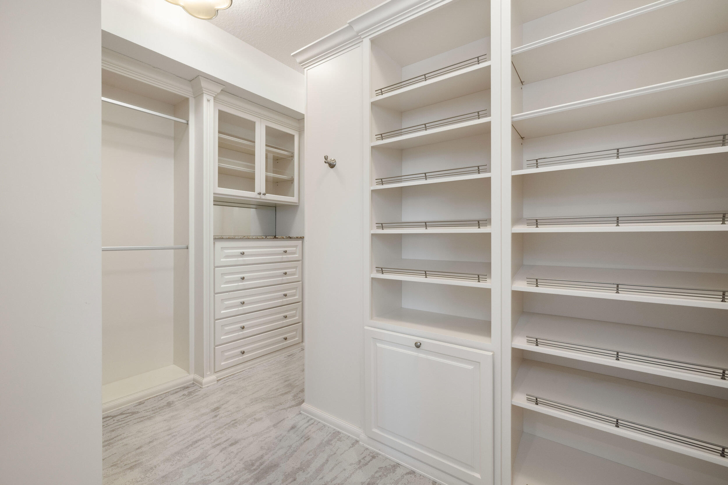 5050 North Ocean Drive, Unit 1502 Singer Island, FL 33404 - Photo 24 of 56 a view of walk in closet with empty racks