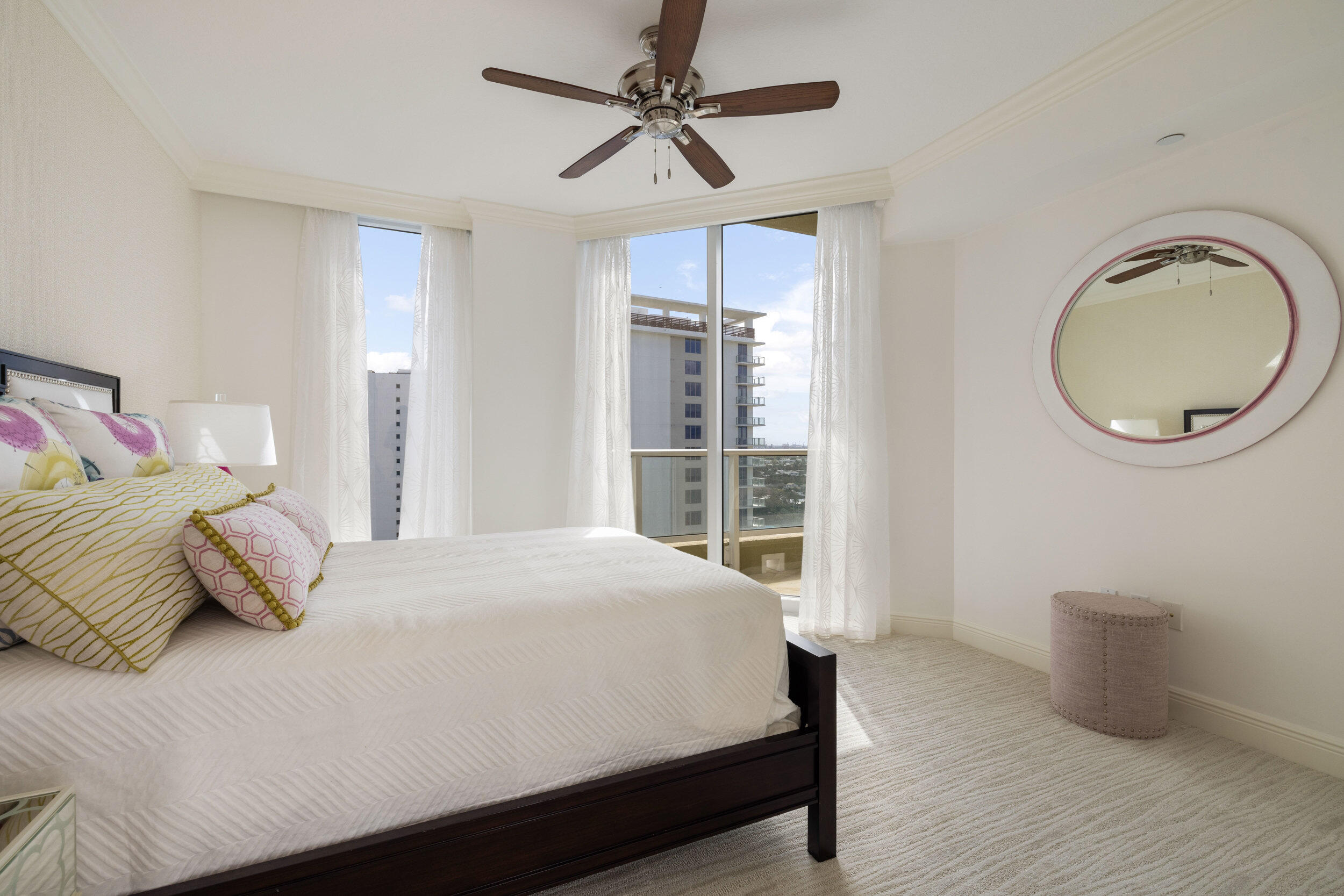 5050 North Ocean Drive, Unit 1502 Singer Island, FL 33404 - Photo 30 of 56 a bedroom with a bed lamp and a large window