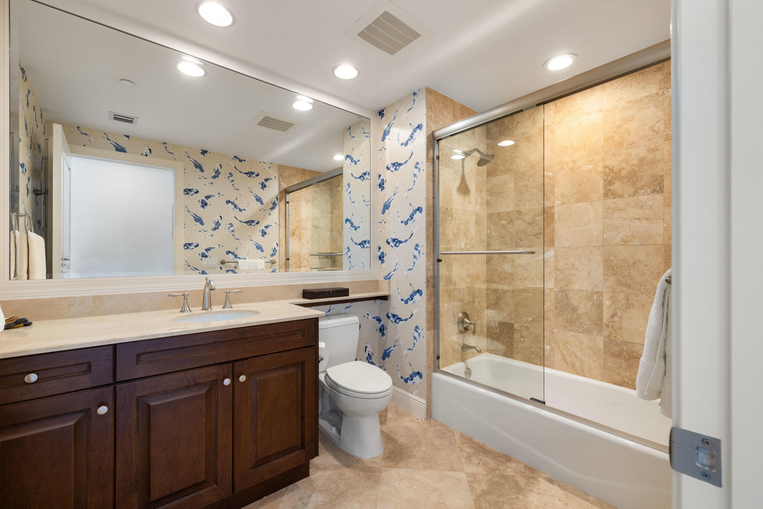 5050 North Ocean Drive, Unit 1502 Singer Island, FL 33404 - Photo 32 of 56 a bathroom with a granite countertop sink toilet and shower