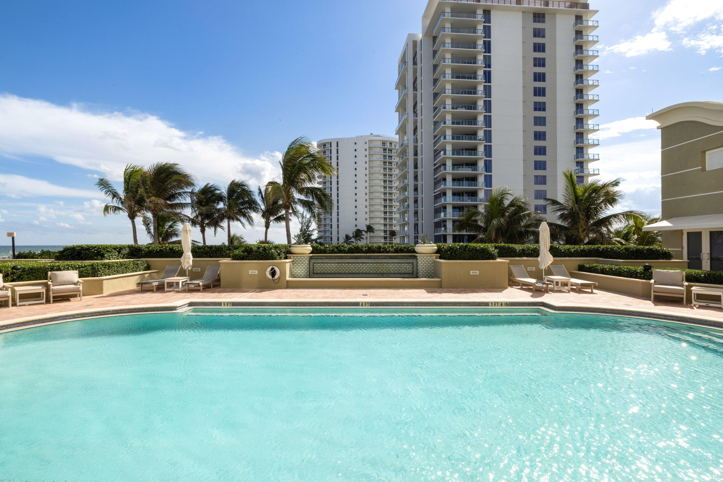 5050 North Ocean Drive, Unit 1502 Singer Island, FL 33404 - Photo 43 of 56 a view of a swimming pool and a yard