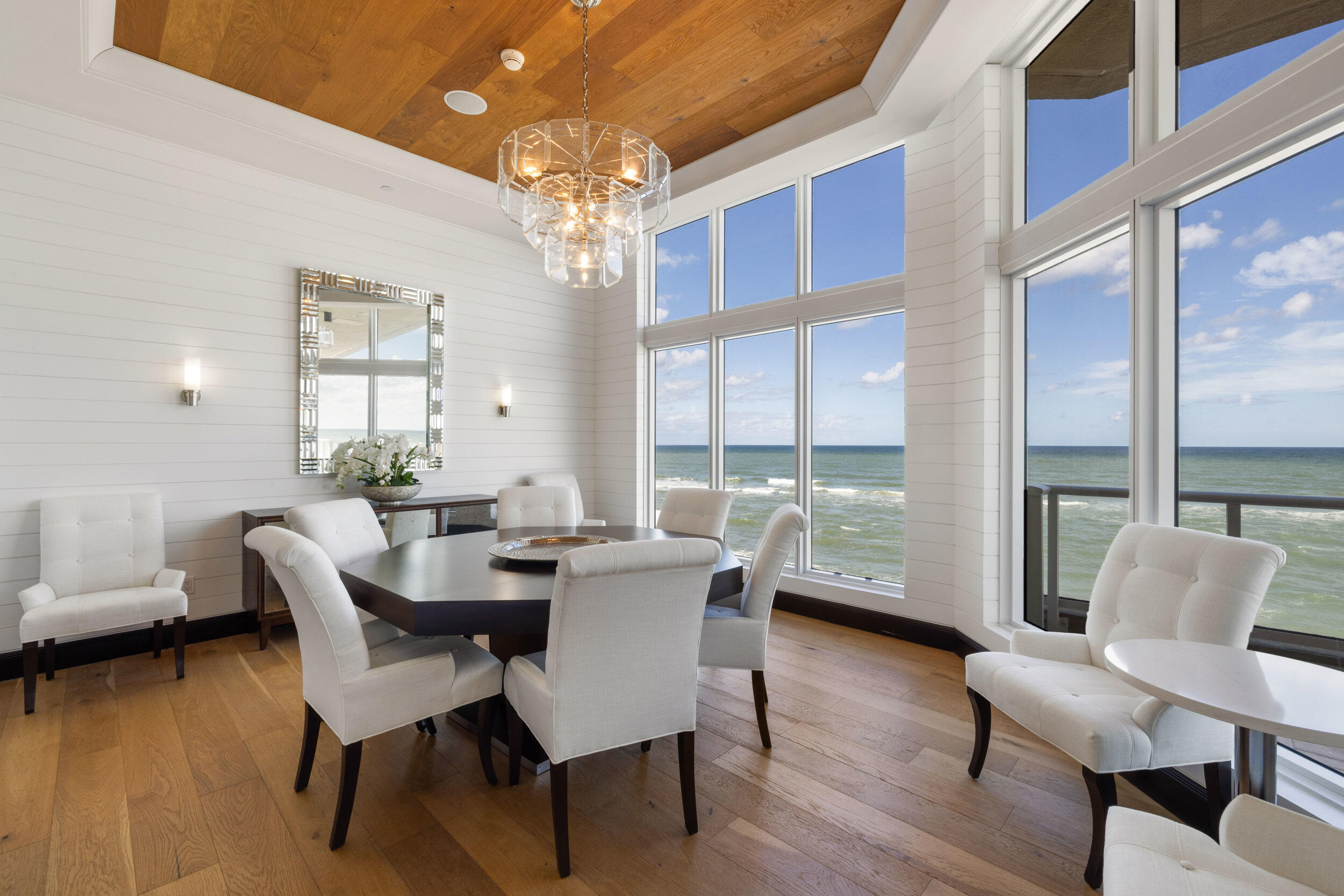 5050 North Ocean Drive, Unit 1502 Singer Island, FL 33404 - Photo 50 of 56 a view of a dining room with furniture window and wooden floor