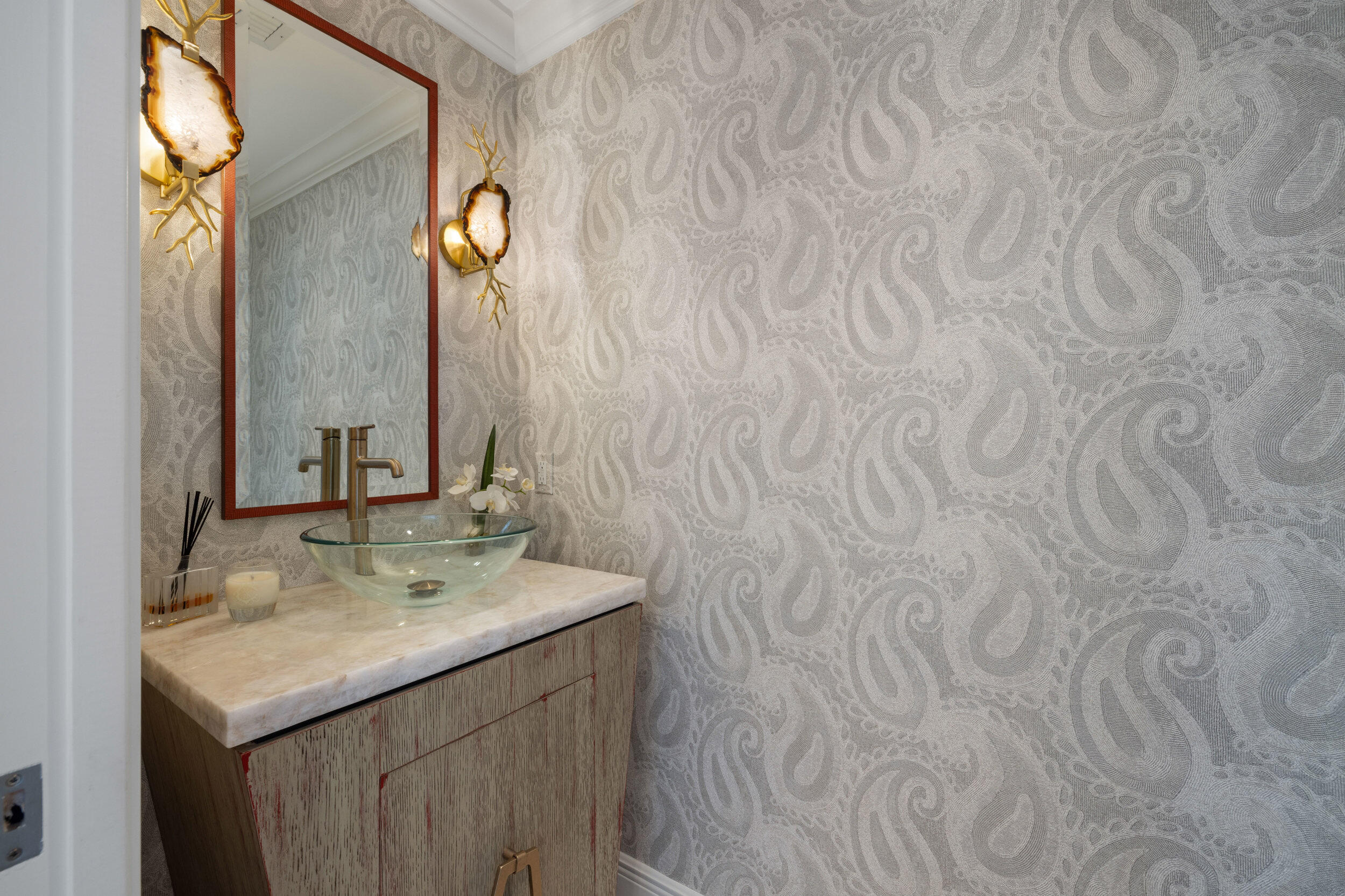 5050 North Ocean Drive, Unit 1502 Singer Island, FL 33404 - Photo 7 of 56 a bathroom with a sink and a mirror