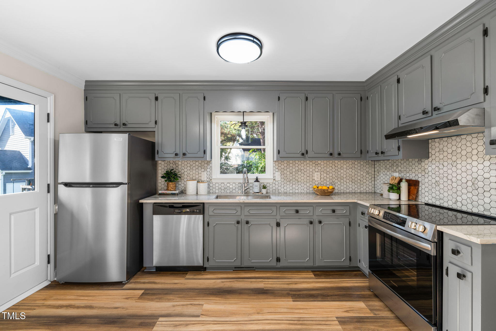 2512 Scouting Trail Raleigh, NC 27615 - Photo 11 of 36 a kitchen with a sink stainless steel appliances and cabinets