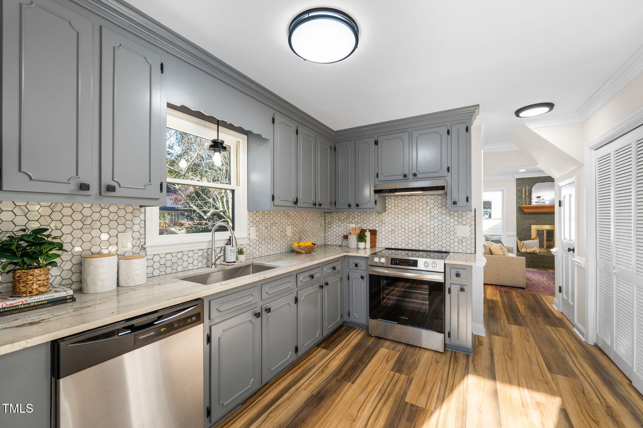 2512 Scouting Trail Raleigh, NC 27615 - Photo 12 of 36 a kitchen with granite countertop a sink stainless steel appliances and cabinets