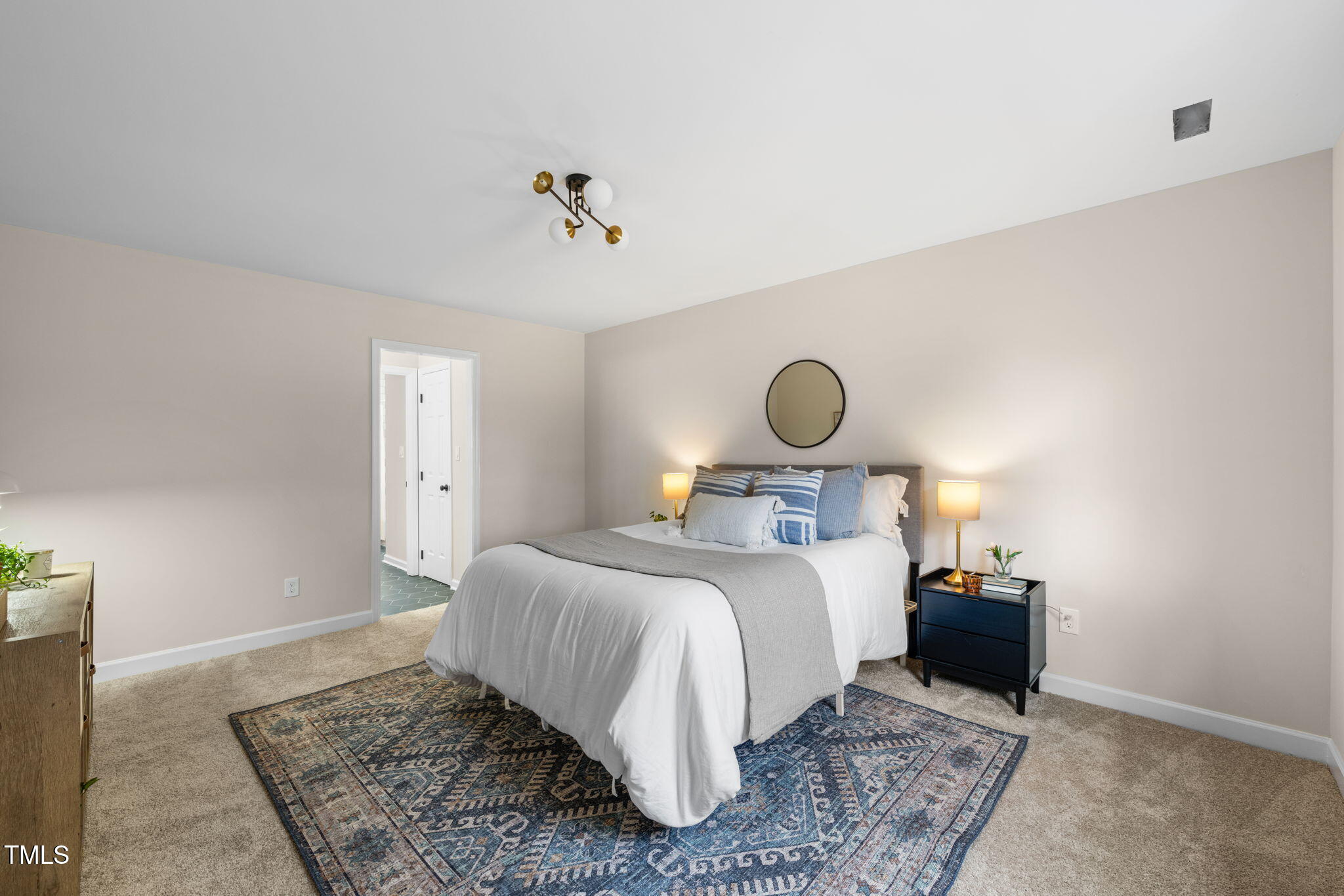 2512 Scouting Trail Raleigh, NC 27615 - Photo 13 of 36 a bedroom with a bed and a lamp