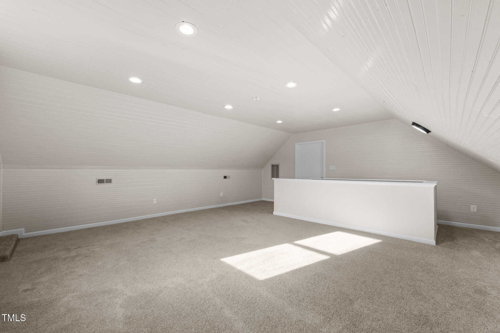 2512 Scouting Trail Raleigh, NC 27615 - Photo 20 of 36 an empty room with a projector and white walls