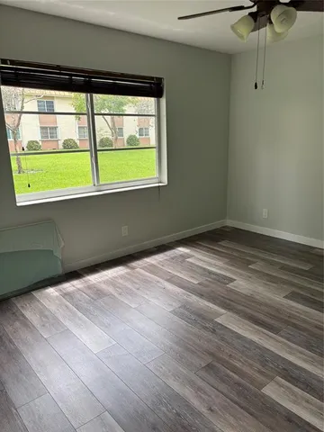 a view of an empty room with a window