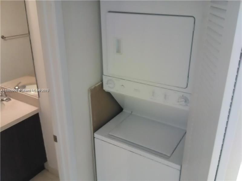 2740 Southwest 28th Terrace, Unit 507 Miami, FL 33133 - Photo 11 of 22 a utility room with dryer and washer