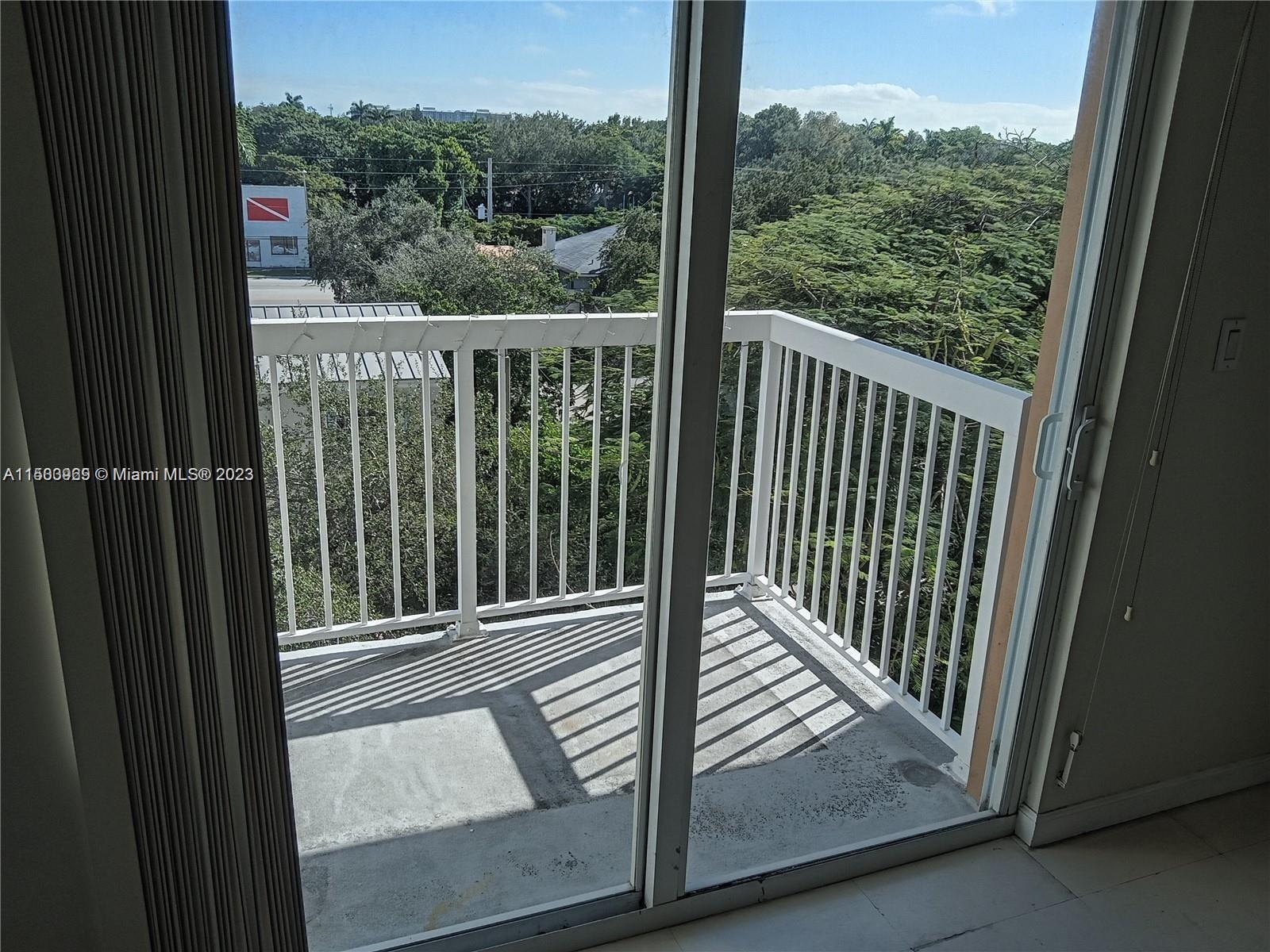 2740 Southwest 28th Terrace, Unit 507 Miami, FL 33133 - Photo 16 of 22 a view of a balcony with a floor to ceiling window