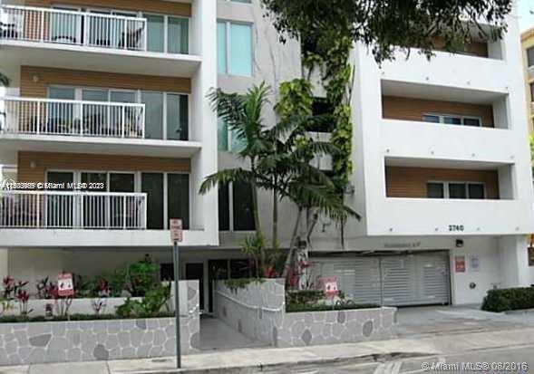 2740 Southwest 28th Terrace, Unit 507 Miami, FL 33133 - Photo 18 of 22 a view of a white house with a potted plant and a large window