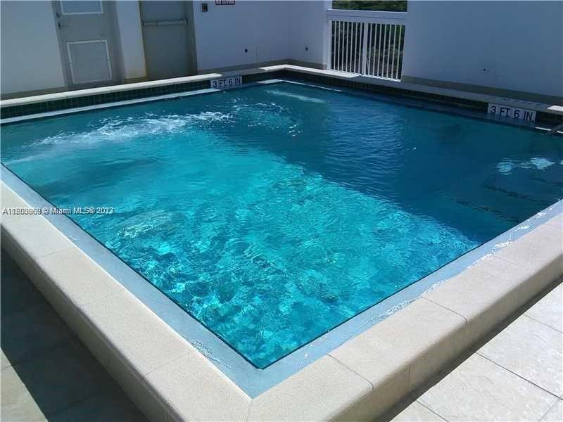 2740 Southwest 28th Terrace, Unit 507 Miami, FL 33133 - Photo 2 of 22 a view of swimming pool from a balcony