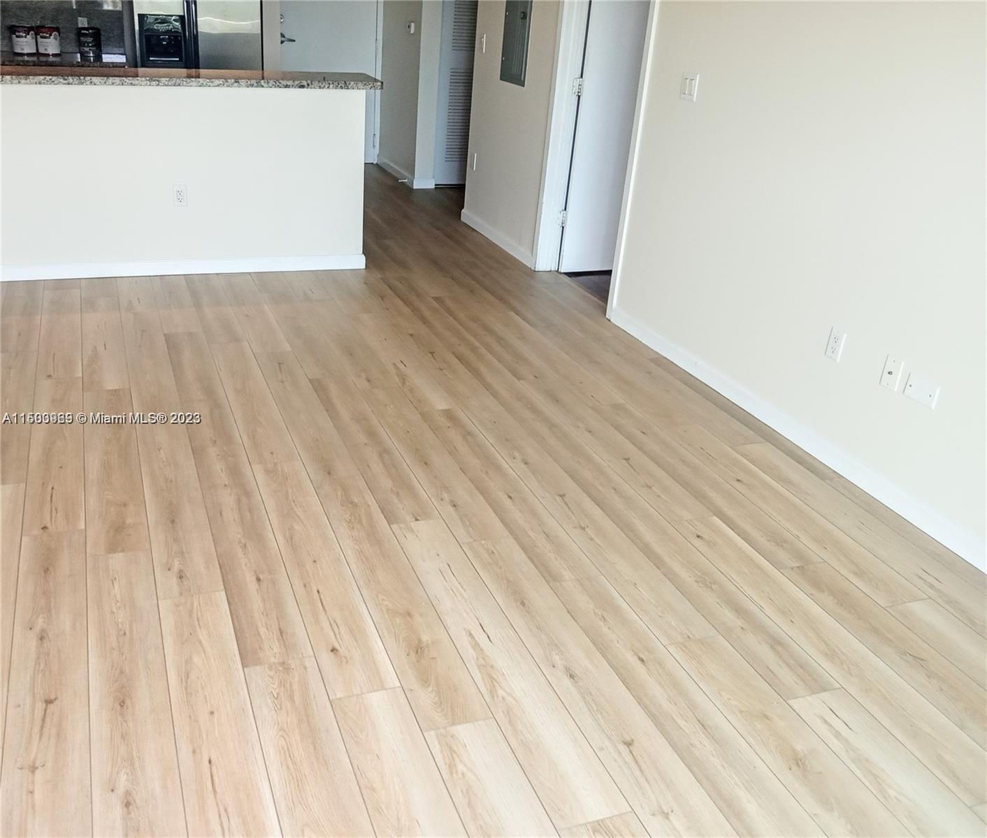 2740 Southwest 28th Terrace, Unit 507 Miami, FL 33133 - Photo 4 of 22 a view of a room with wooden floor