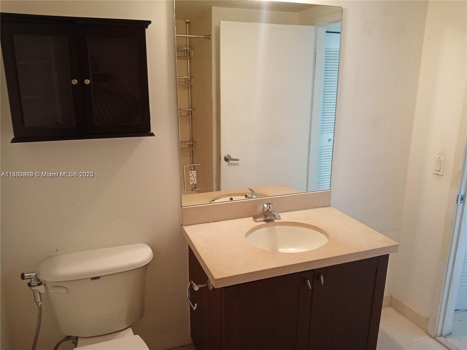2740 Southwest 28th Terrace, Unit 507 Miami, FL 33133 - Photo 10 of 22 a bathroom with a sink and a toilet