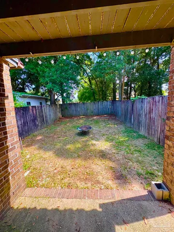 a view of a backyard with a small cabin