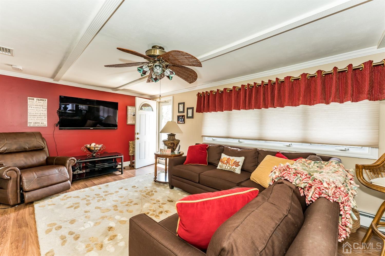 41 Trafalgar Drive Colonia, NJ 07067 - Photo 2 of 40 a living room with furniture and a flat screen tv